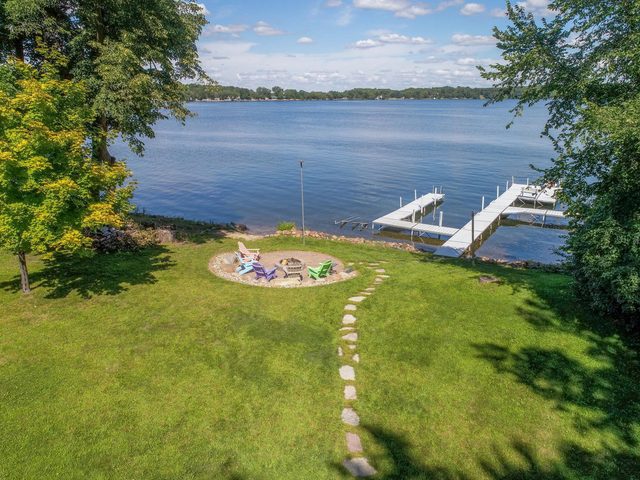 Lakeshore fire pit and dock at 11615 Gehrkes Point NW